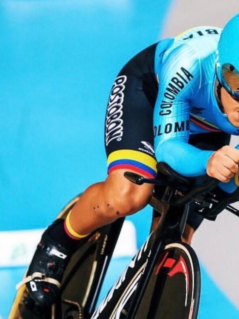 Colombian man riding his bike in a velodrome