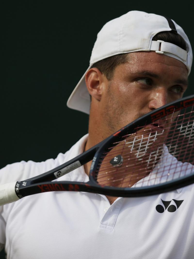 Close shot on Argentinian wheelchair tennis player Gustavo Fernandez about to serve