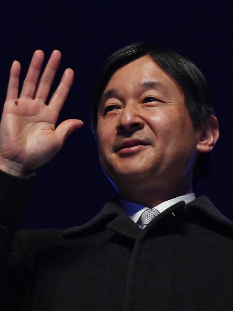 Emperor Naruhito of Japan waves to the crowd