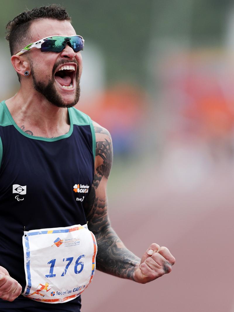 Brazilian sprinter Vinicius Rodrigues screams in joy after a race