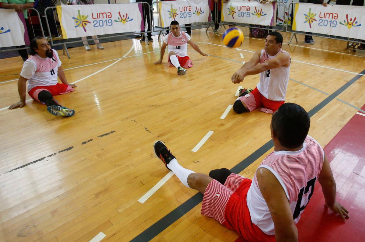 Peruvian sitting volleyball player Bruno Jose Quiros Davalos hits the ball