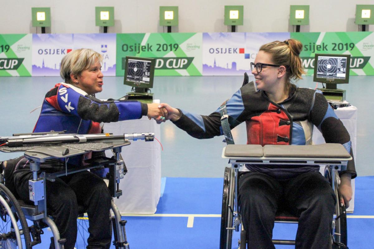 Veronika Vadovicova fist bumps athlete after winning gold.