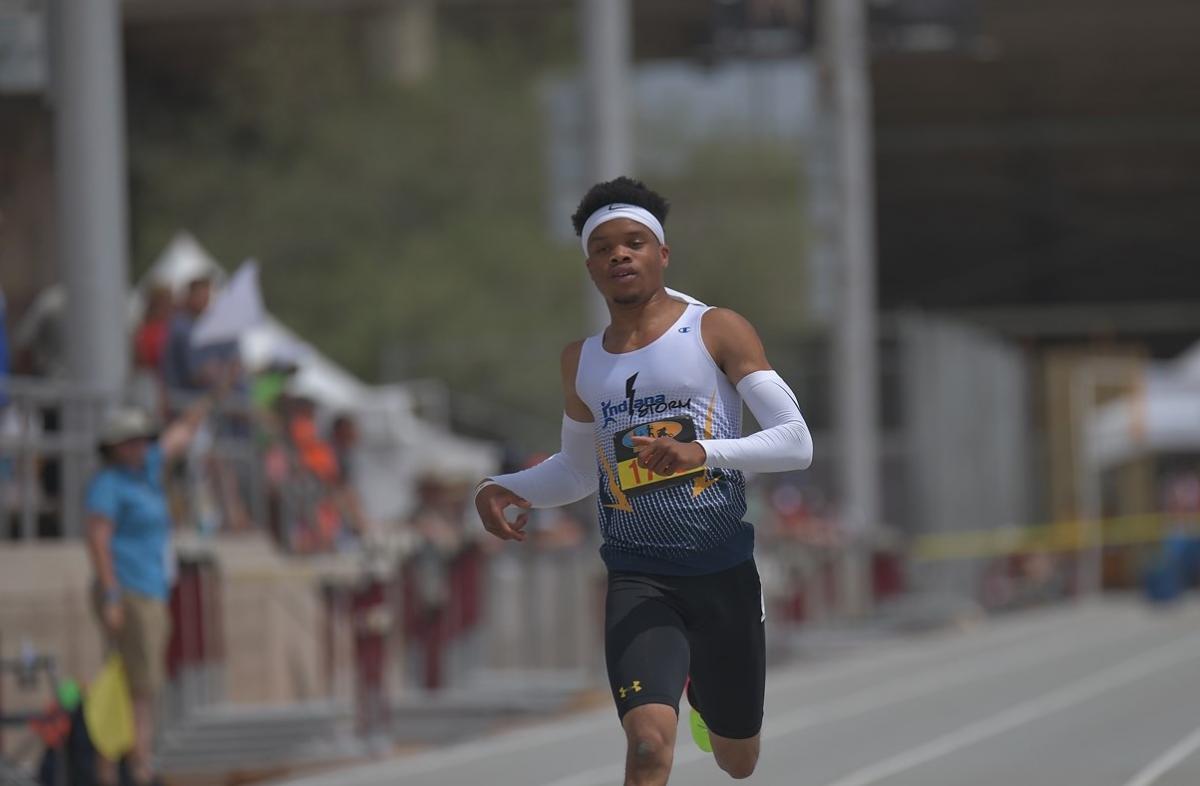 A man running on an athletics track