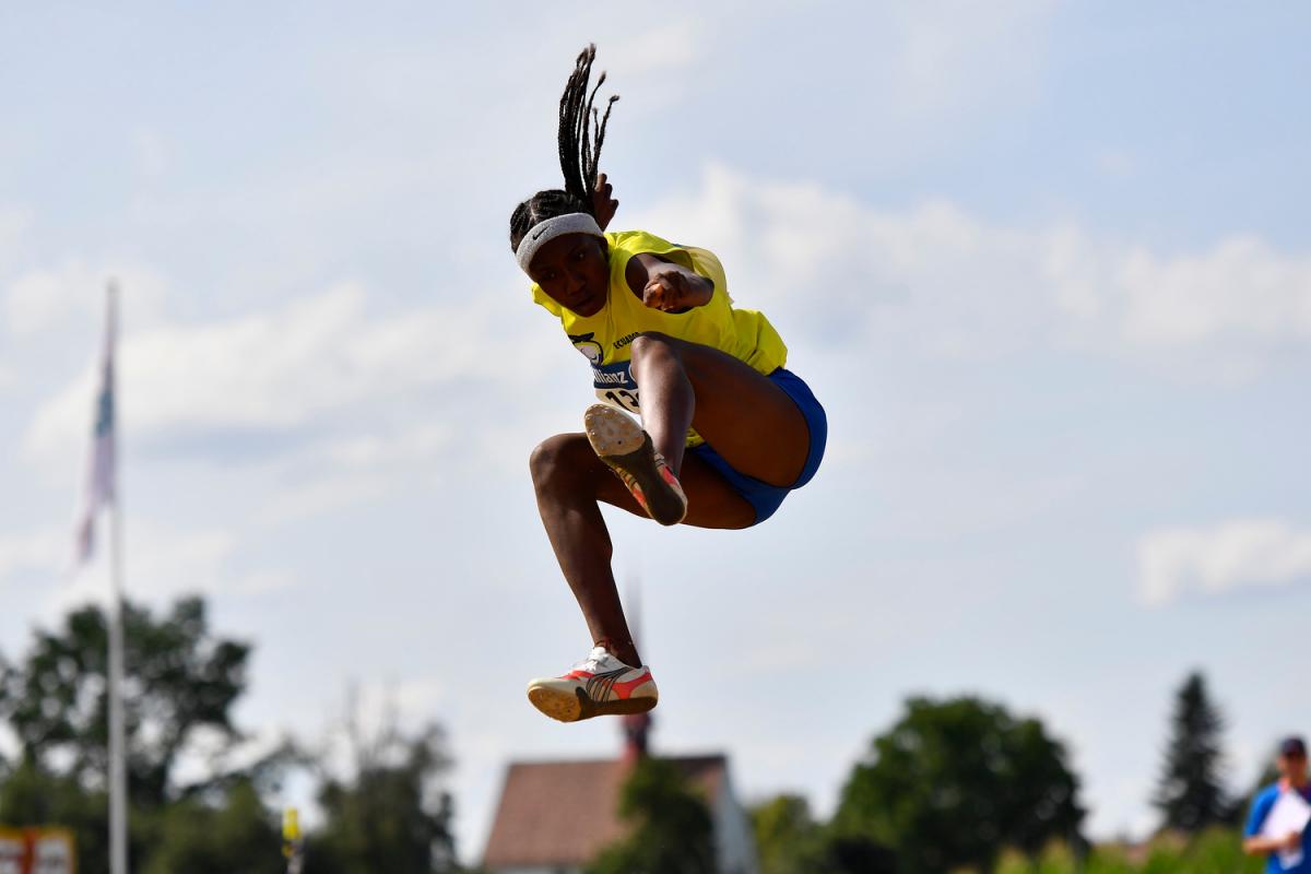 Ecuadorian athlete Kiara Rodriguez flies in the air after her jump