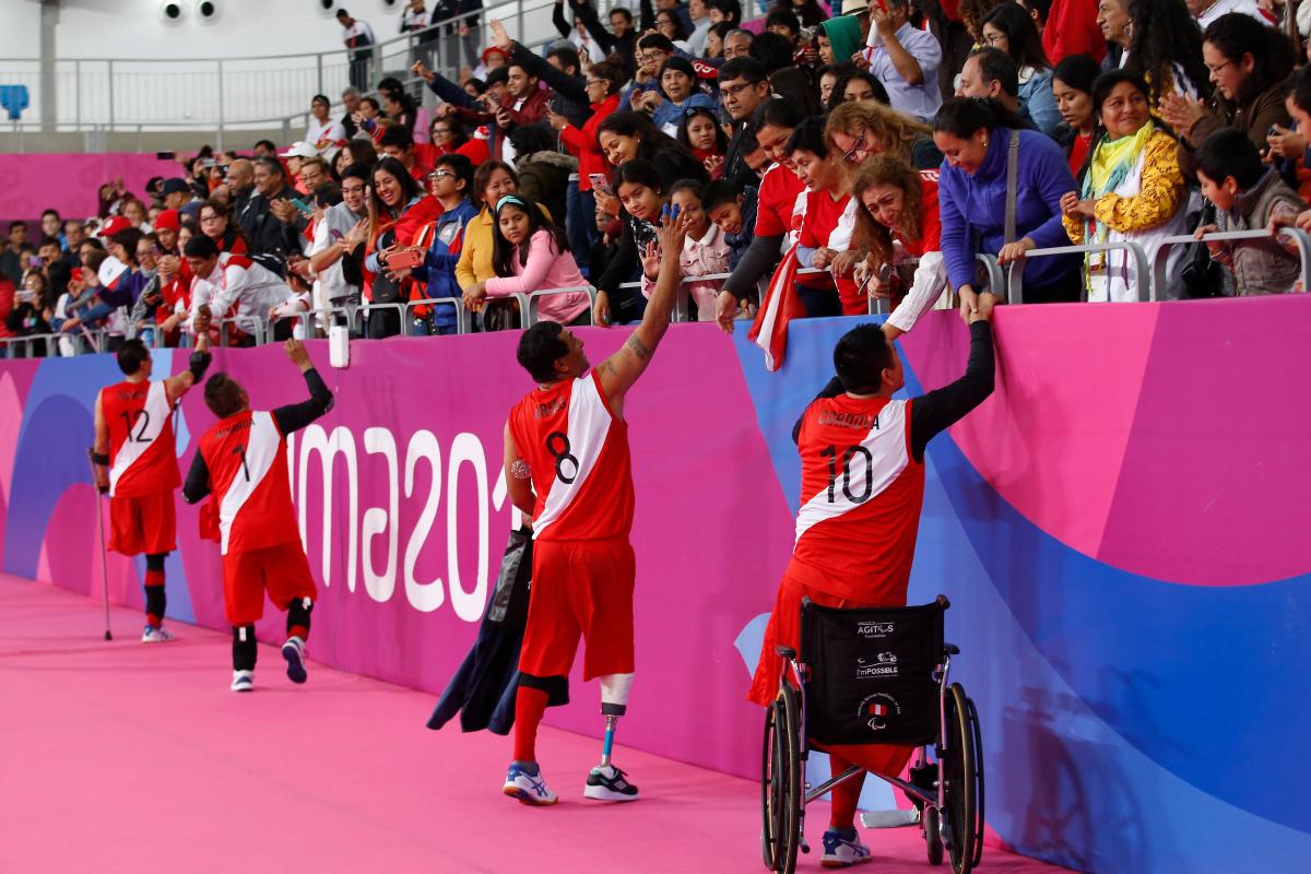 Peruvian sitting volleyball players cheered by the crowd