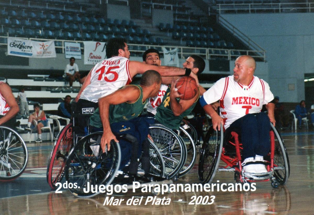 male basketball players fighting for the ball