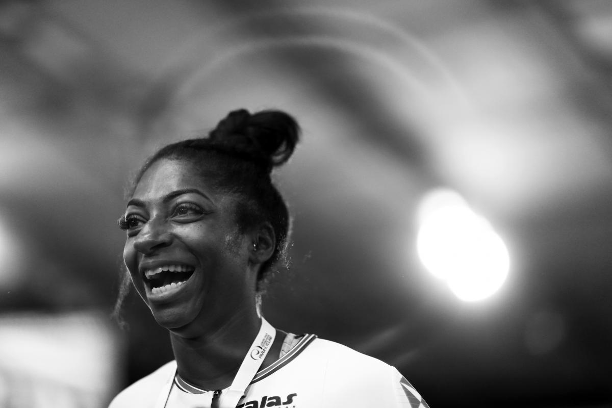 a female Para cyclist smiling