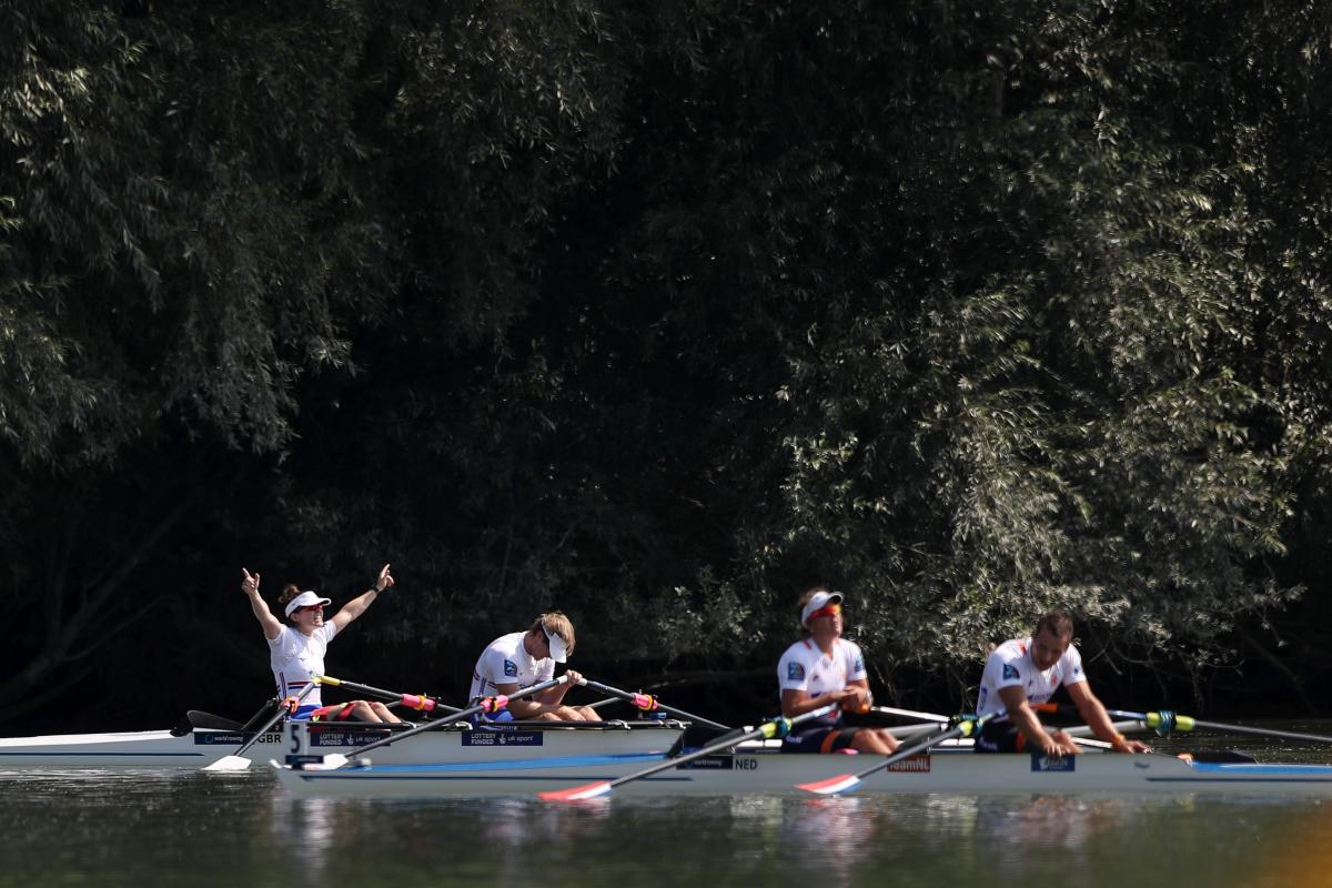 British rowing crew celebrates while Dutch rowing crew looks disappointed