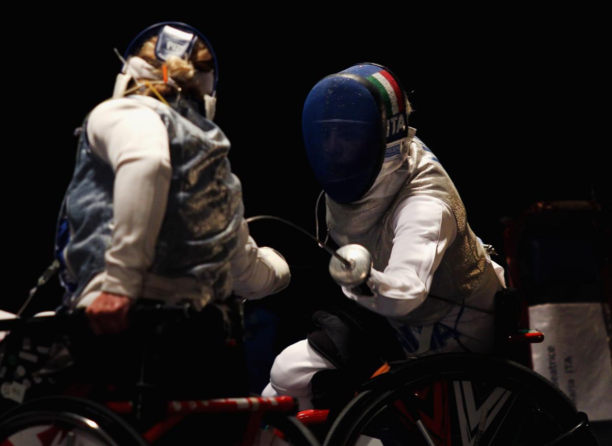 Two women fencing