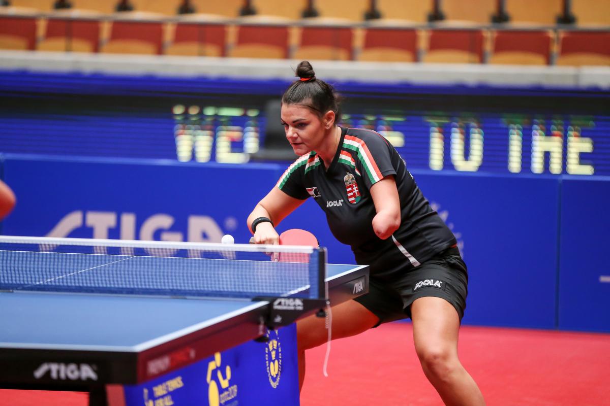 Hungarian table tennis player with left arm amputation returns a shot