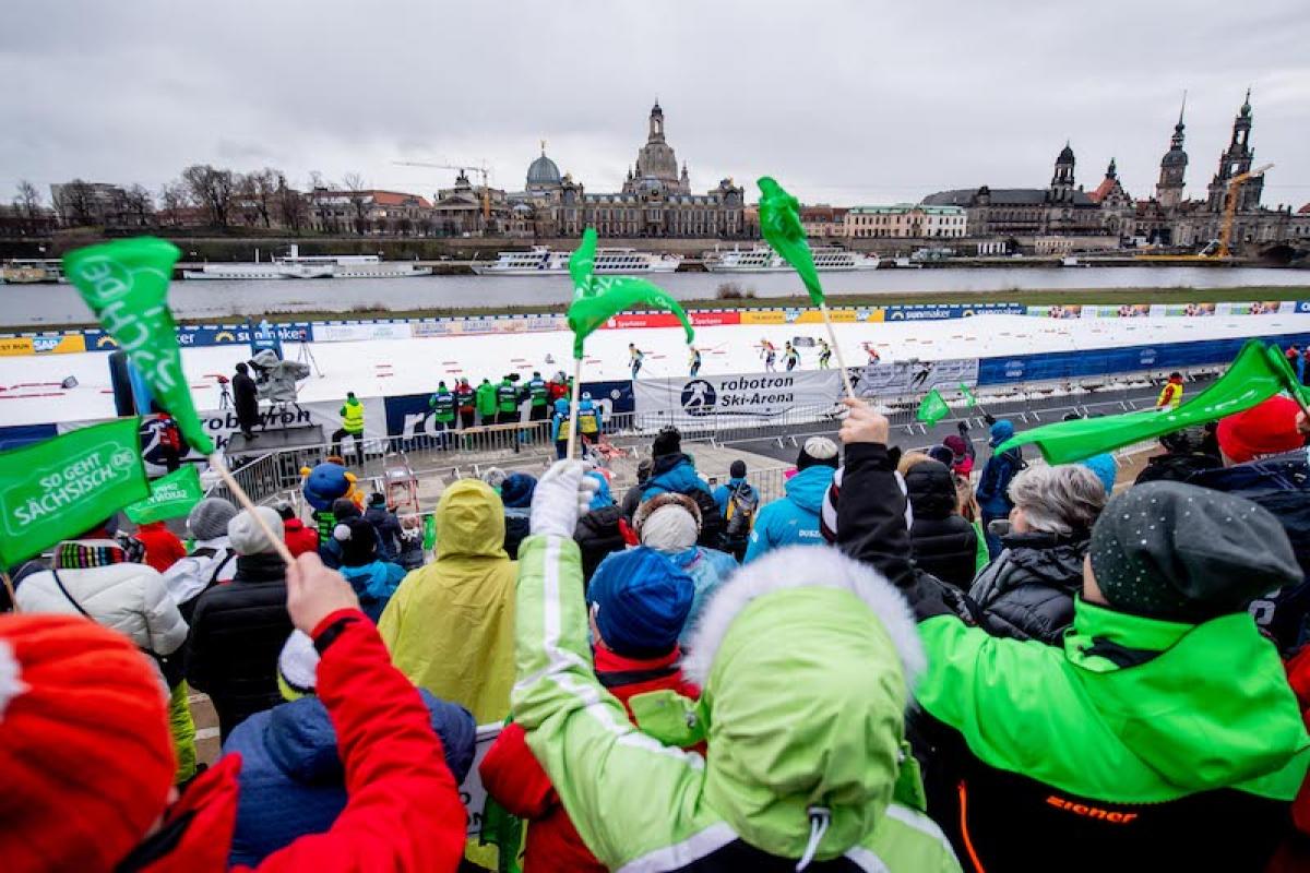 A group of fans watching a cross-country skiing competition in the centre of Dresden