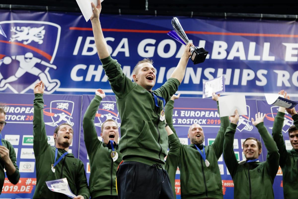 German players lift their arms in celebration