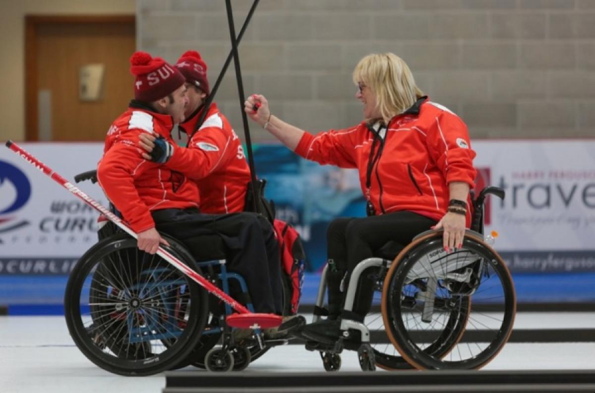 JUBILANT ALL: Hans Burgener, Francoise Jaquerod and Eric Decorvet celebrate Switzerland's win at Stirling 2019