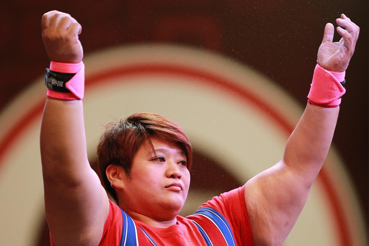 Chinese Taipei's powerlifter Tzu-Hui Lin raises her arms