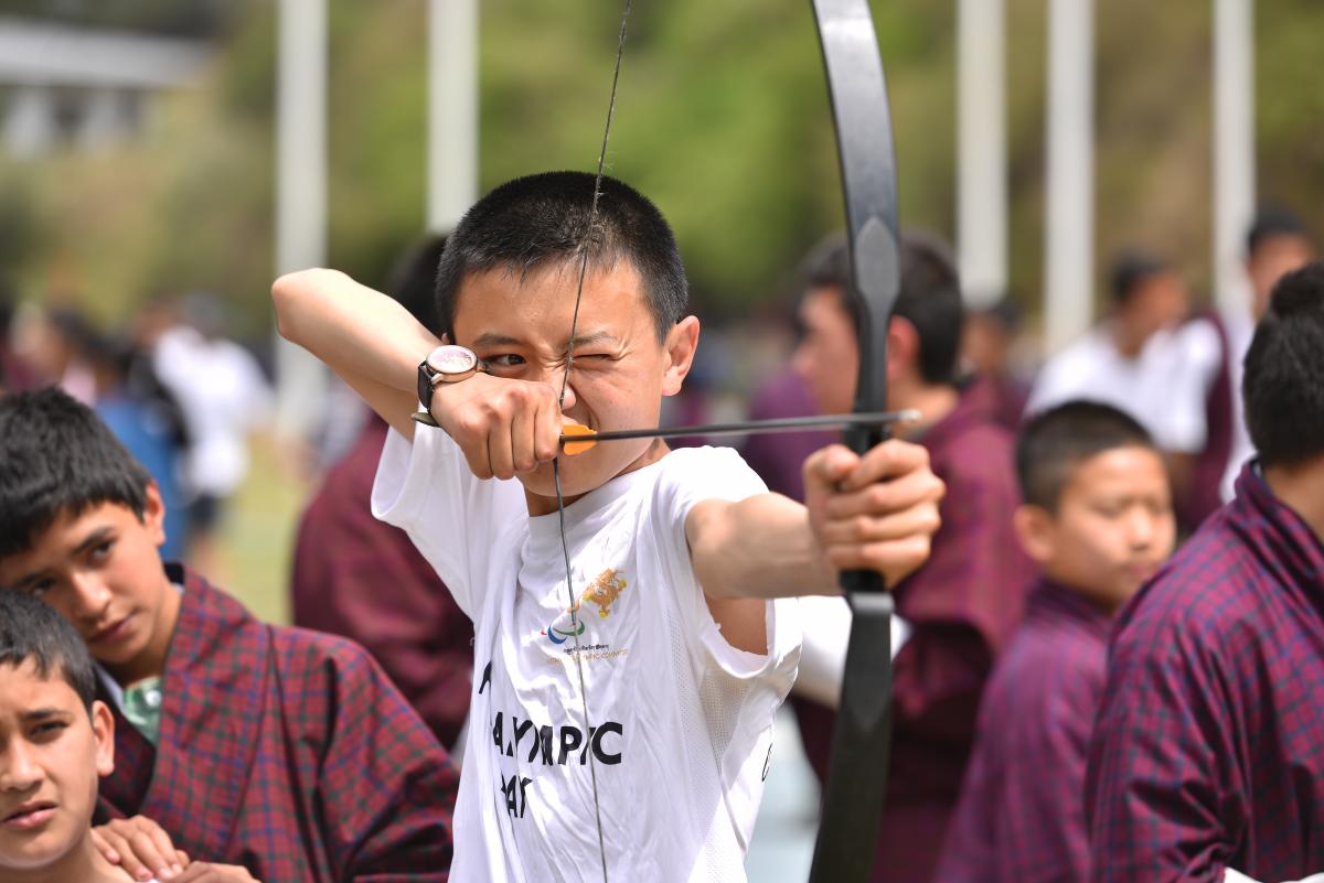 Boy tries Archery during Paralympic Day in Bhutan