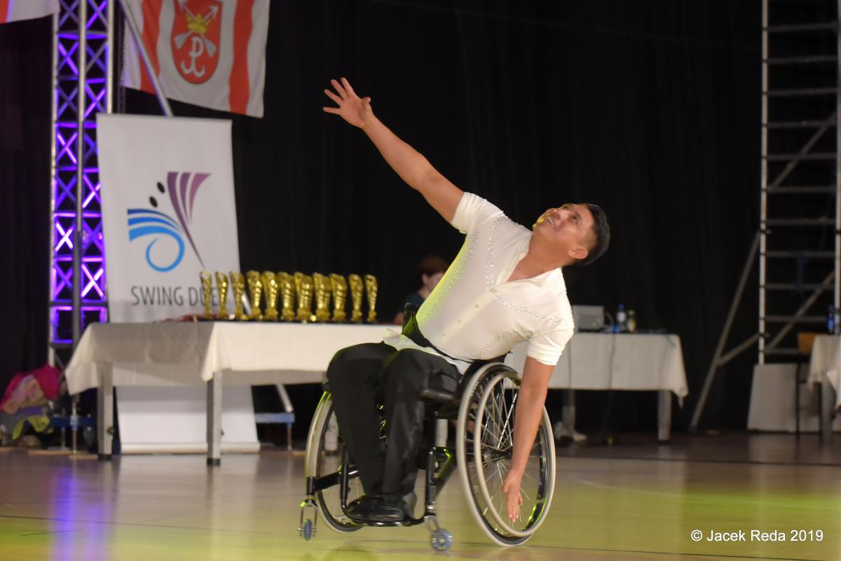 Mexican man in wheelchair dancing