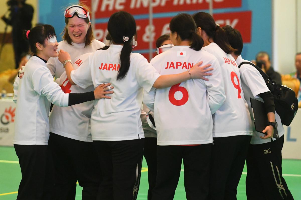 Japanese female goalball players embracing