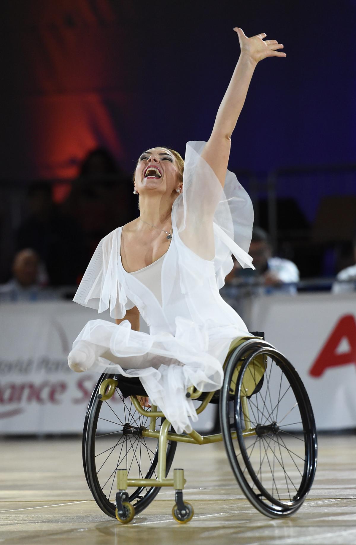 Woman in wheelchair performs expresses emotion in dance