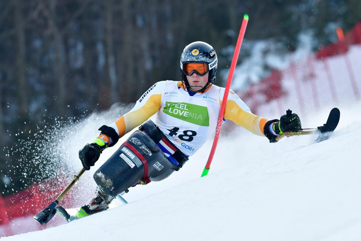 A male sit-skier competing on the snow