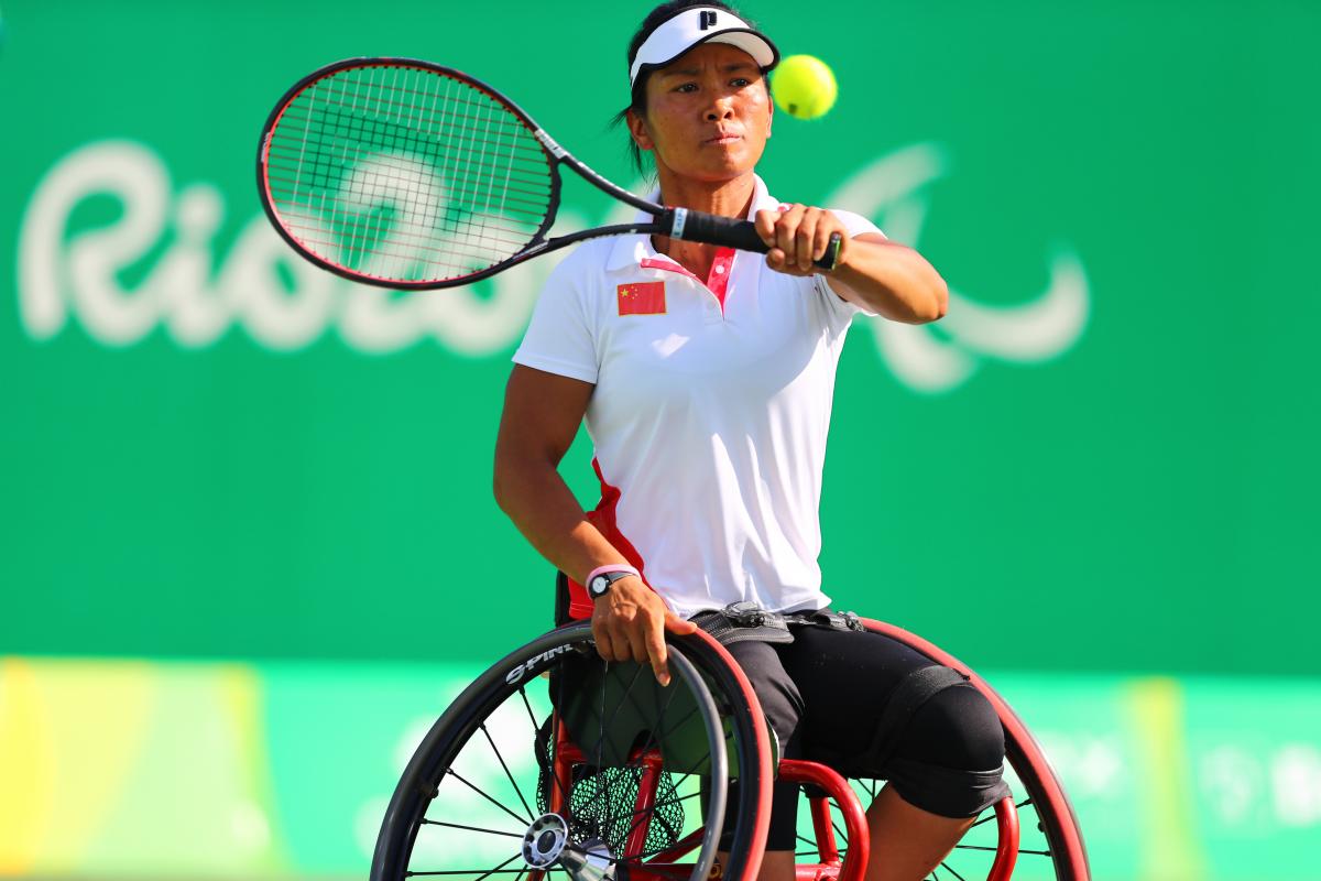 Chinese wheelchair tennis player Zhenzhen Zhu hitting a forehand