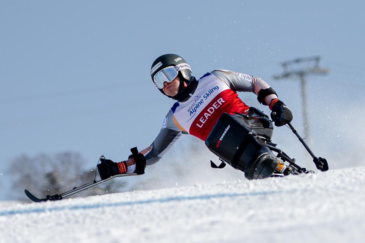 A male sit-skier competing on the snow