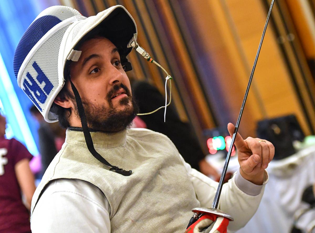 Male French wheelchair fencer with his helmet off