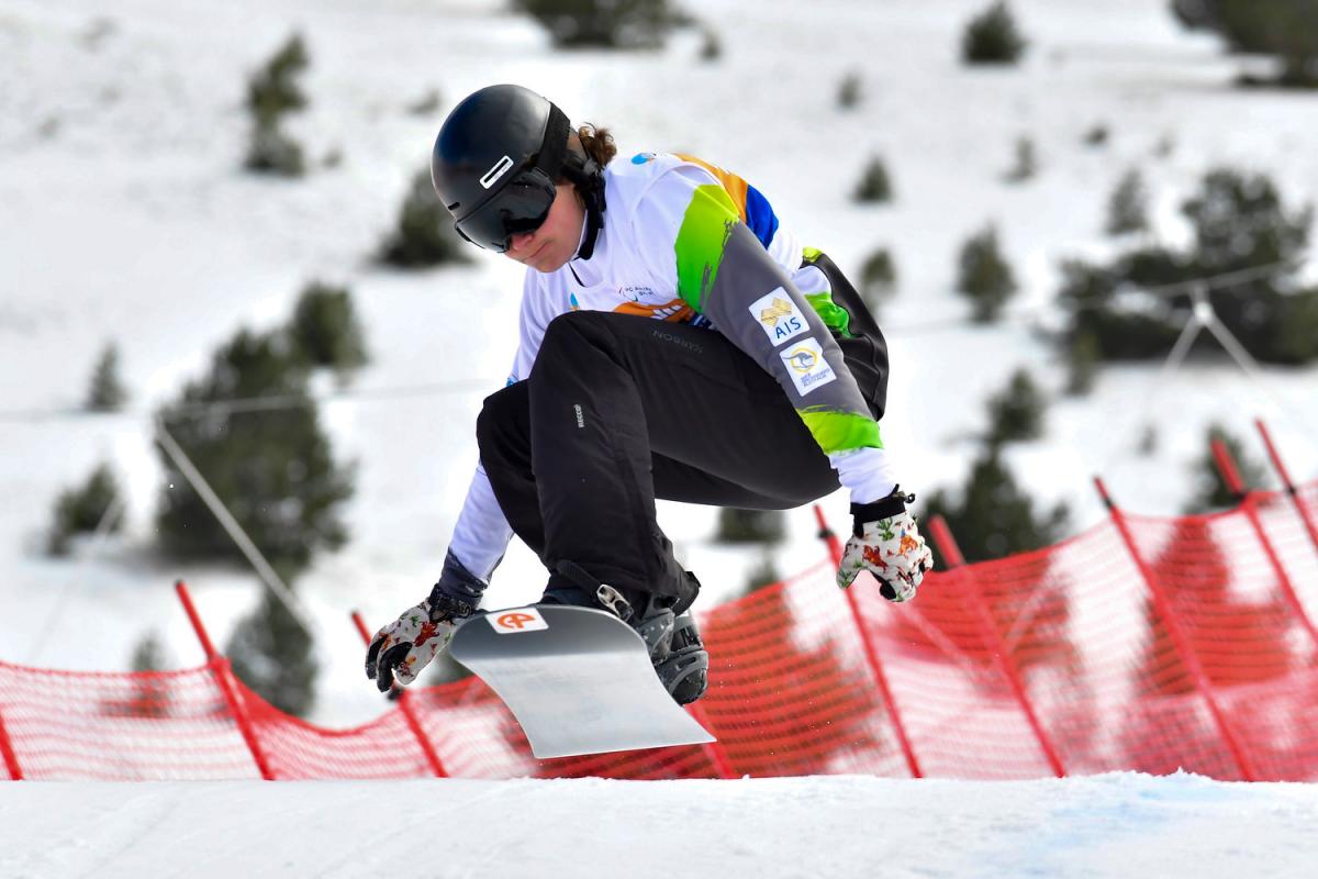 A man snowboarding 