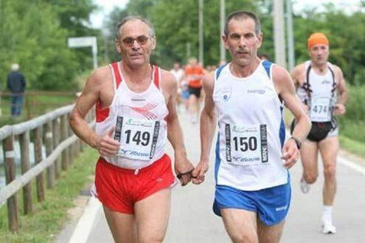 Blind marathon runner with his guide