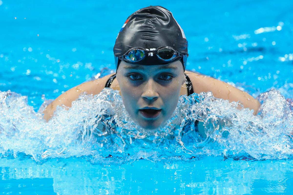 Female swimmer competing in the water
