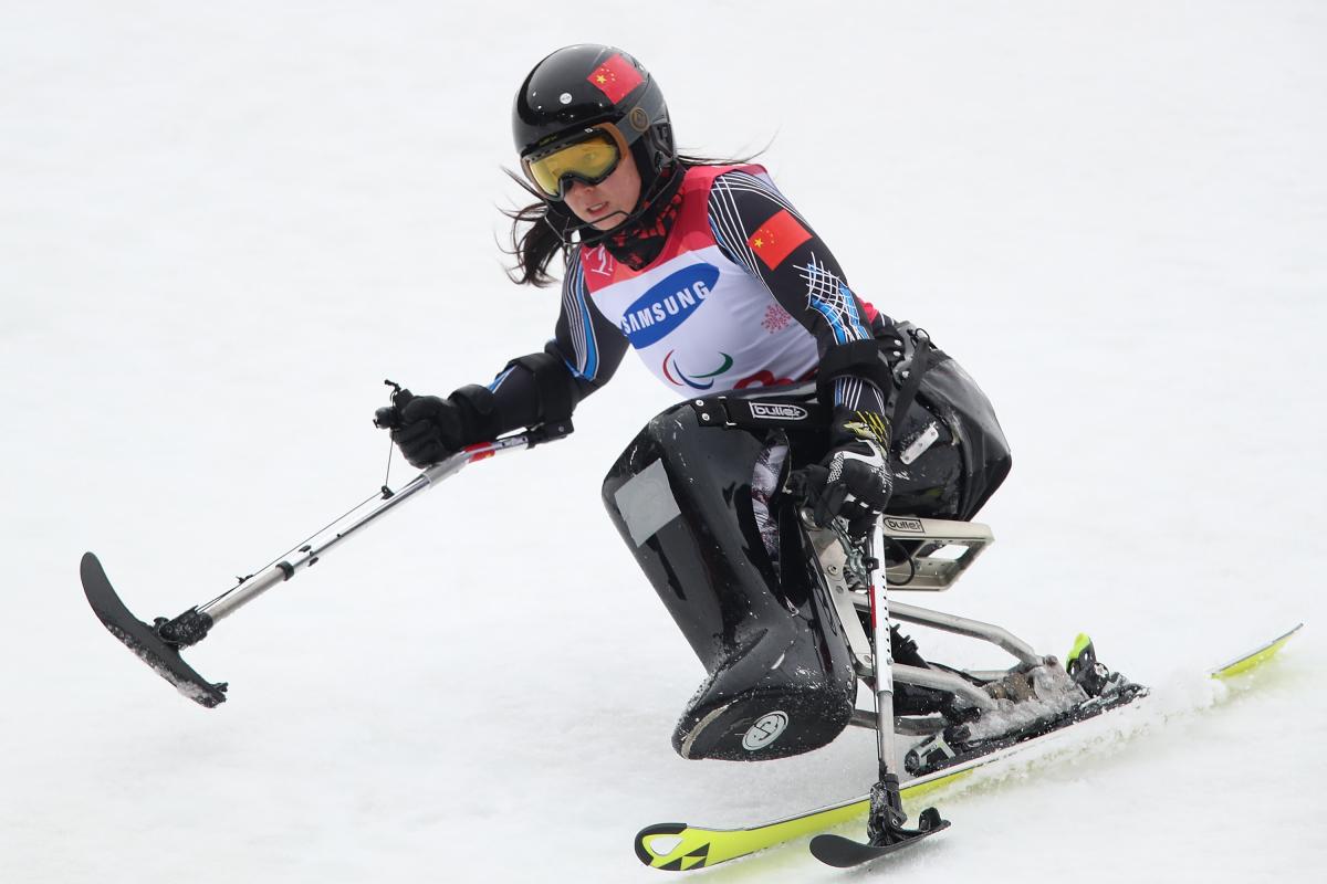 A female Para alpine sit-skier competing