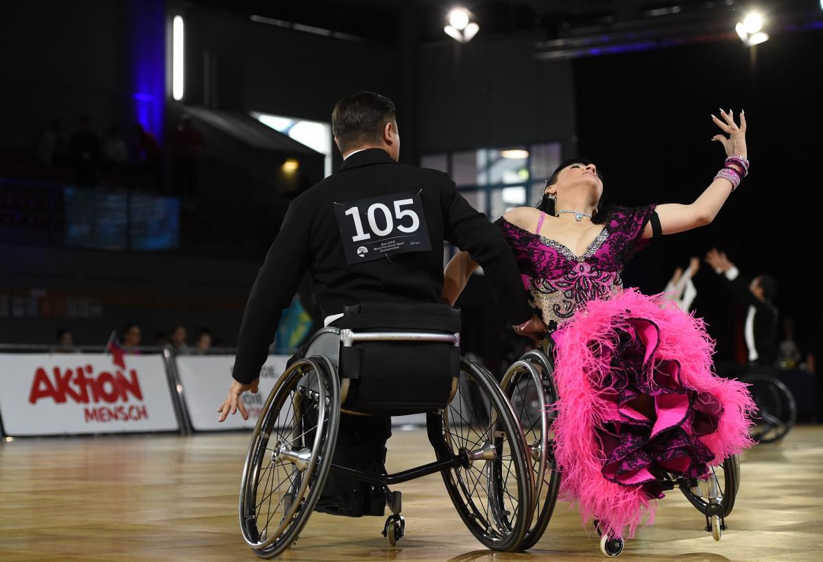 A couple in wheelchairs dancing