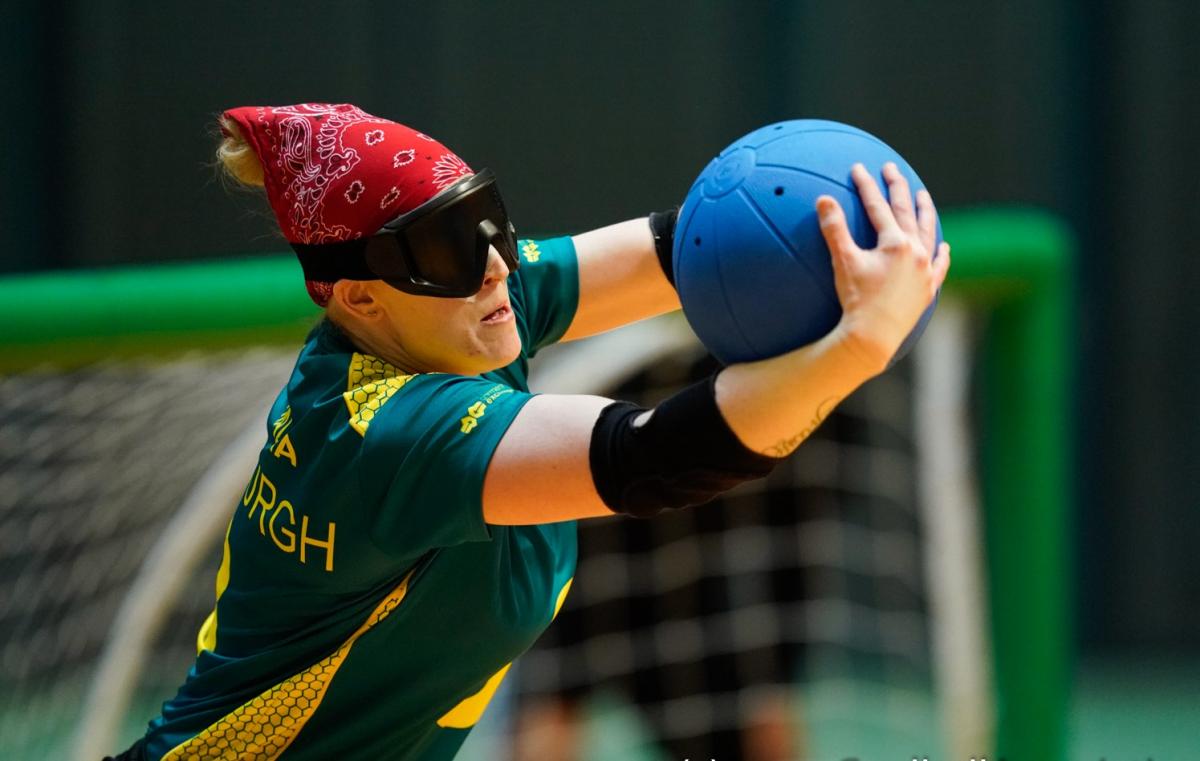 Female goalball player prepares to release the ball