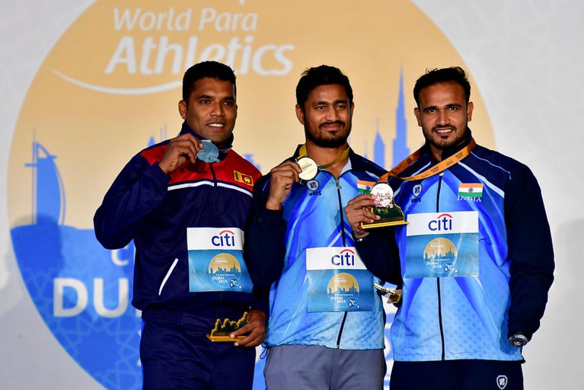 Three male javelin throwers on the podium