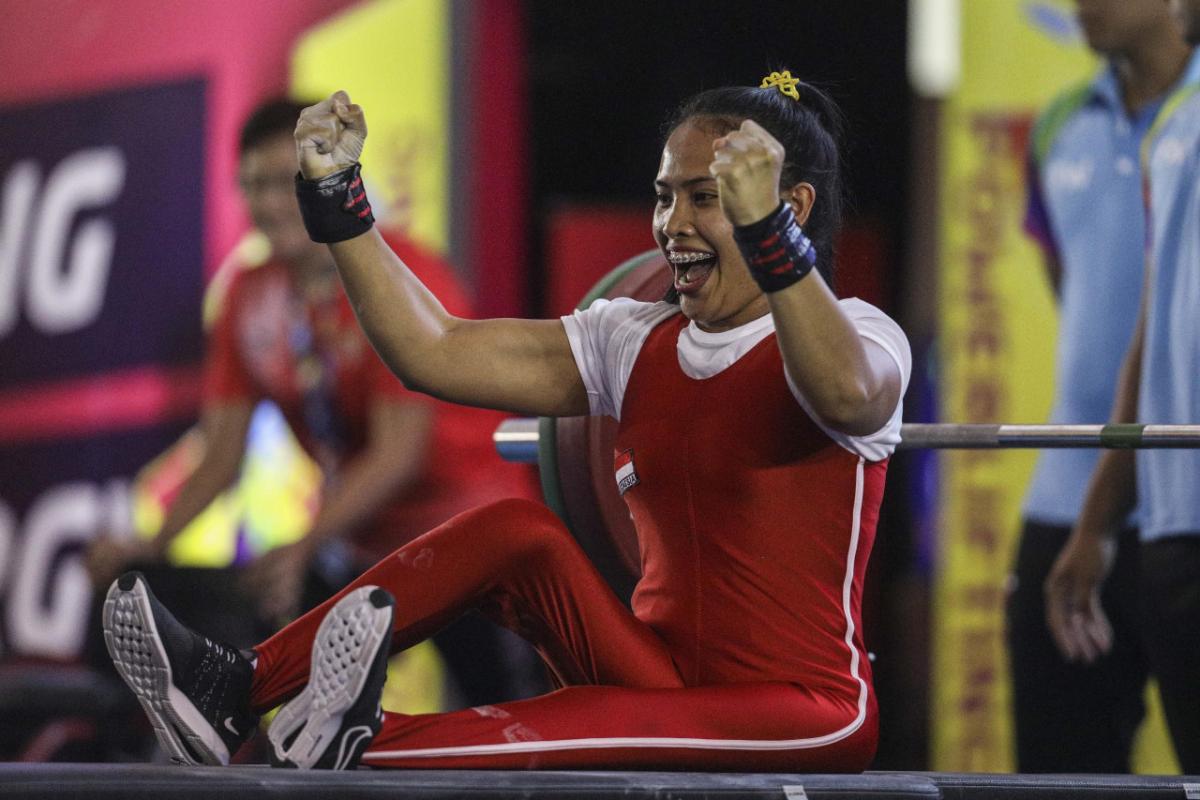 Indonesia Para powerlifter celebrates after her lift