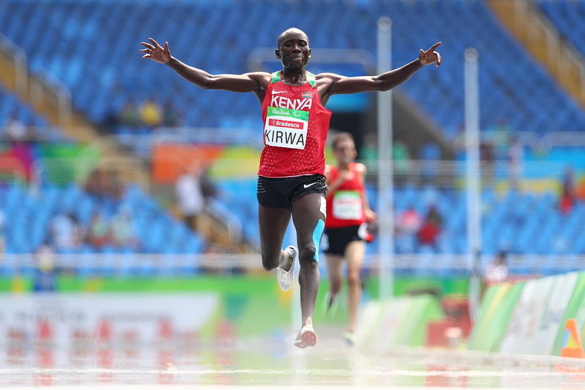 Photo of Kenya runner celebrating after crossing the finish line