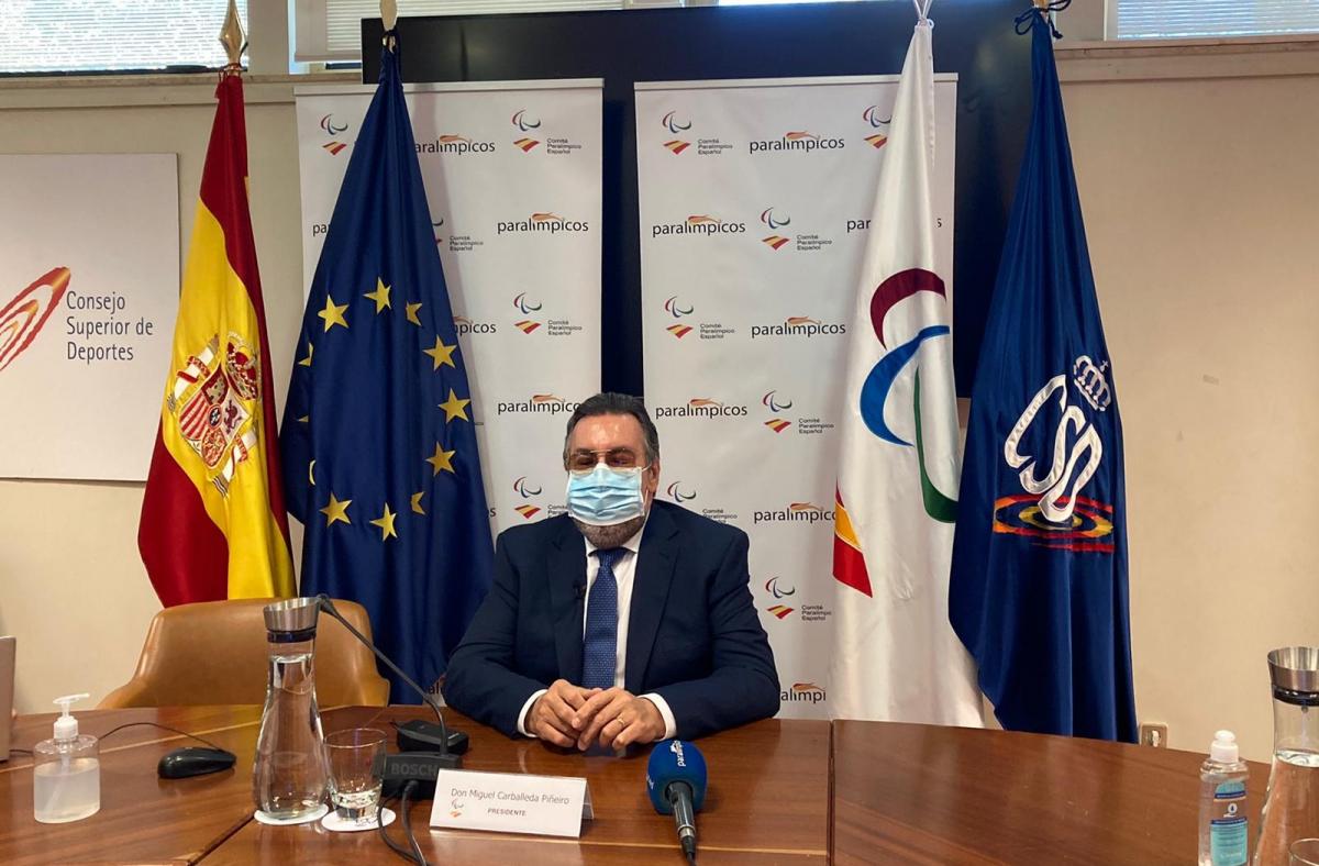 Miguel Carballeda sitting at a table