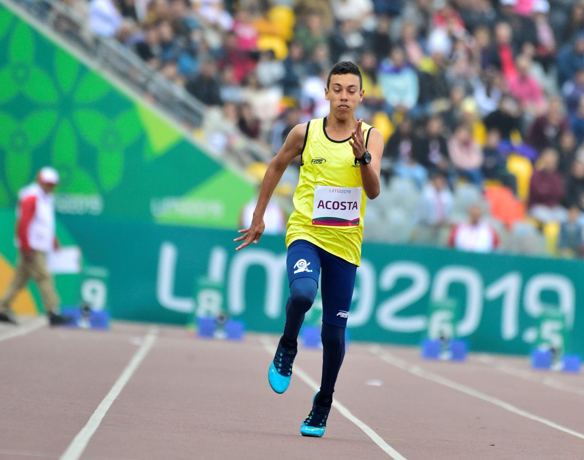 Colombian male athlete sprinting on the track