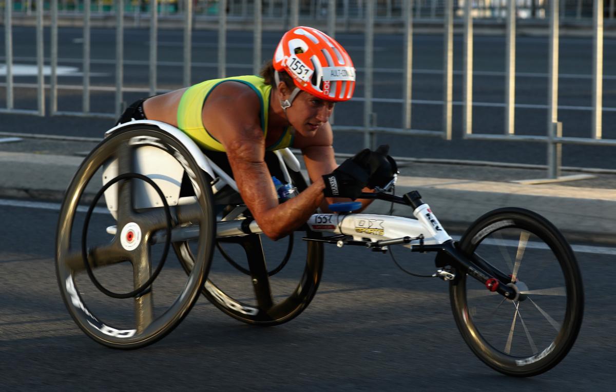 Female wheelchair racer competing 