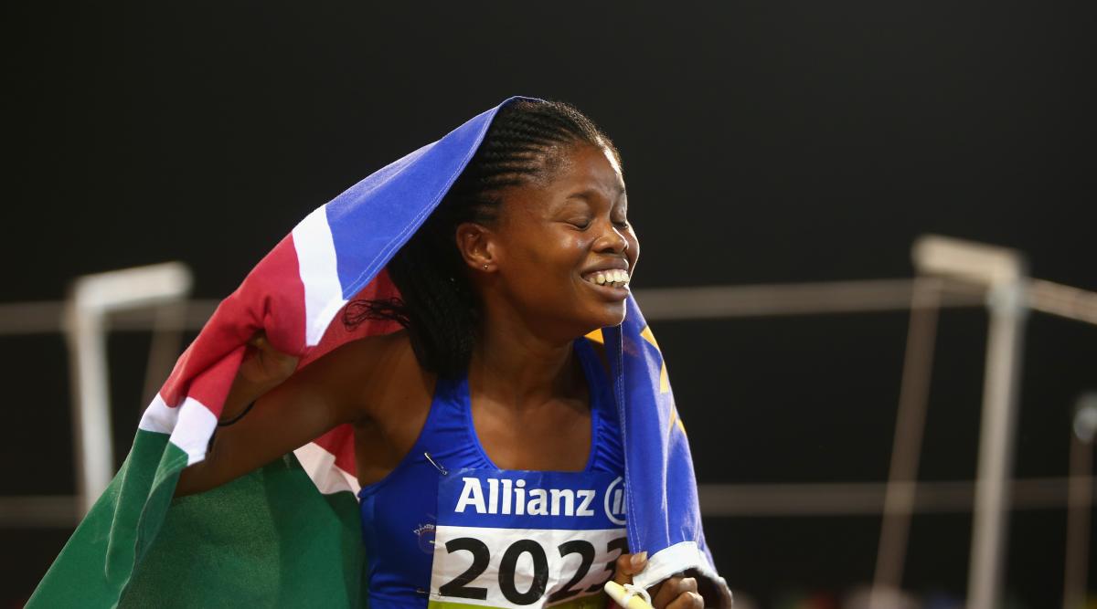 Johanna Benson holding the Namibian flag