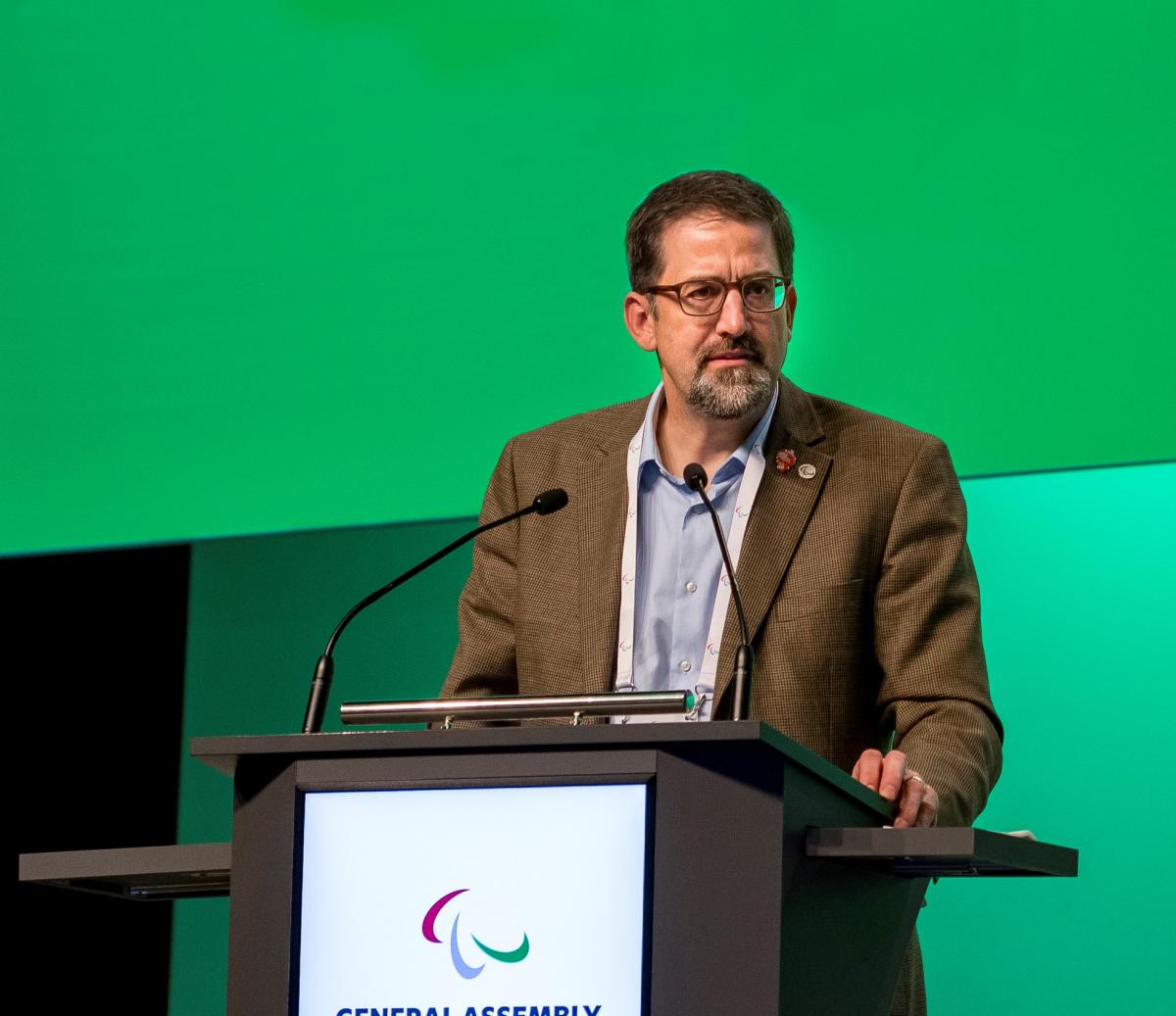 Man speaking on a podium