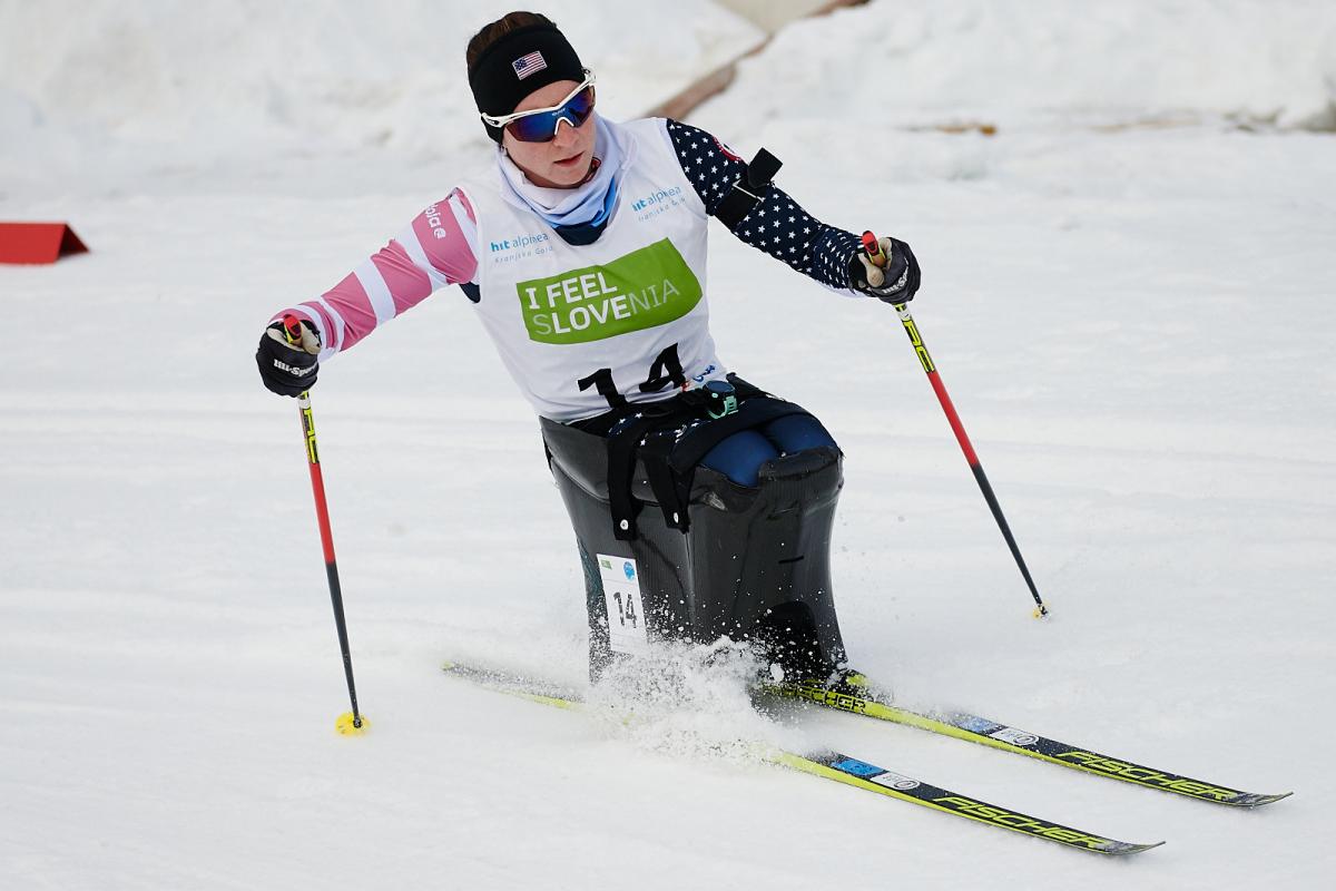 A female sit-skier in a cross-country competition
