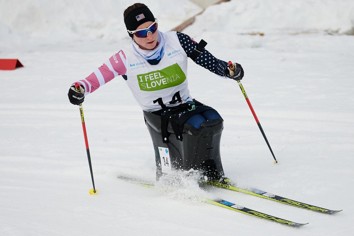 A female sit-skier in a cross-country competition 