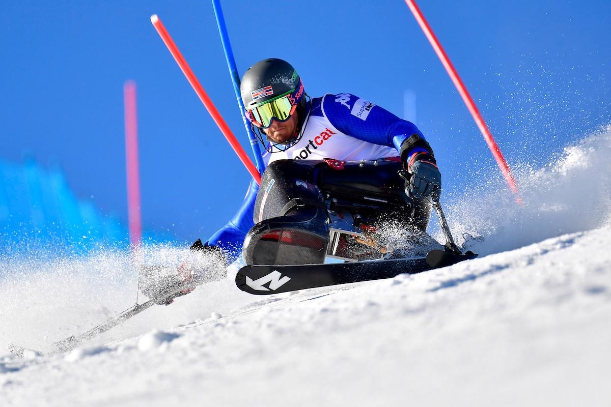 A male sit-skier in a slalom competition
