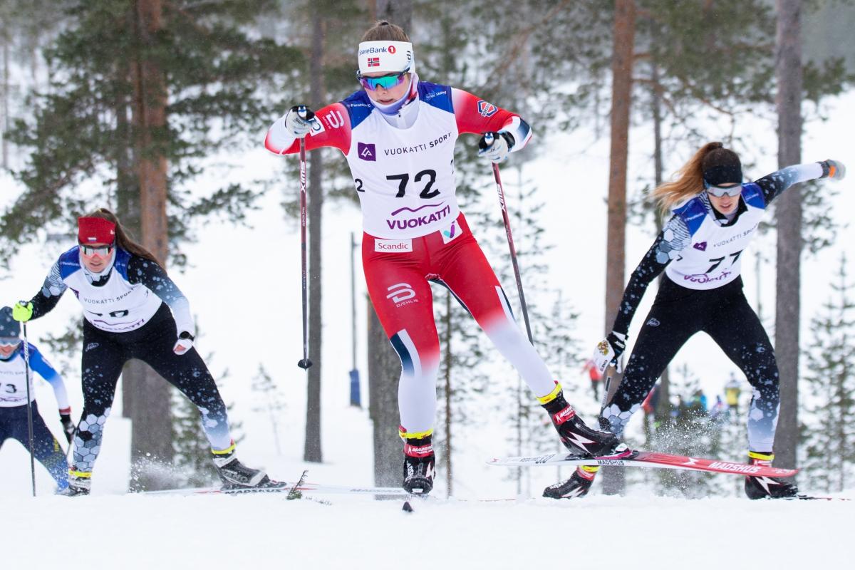Vilde Nilsen competing in cross country skiing alongside other two women athletes 