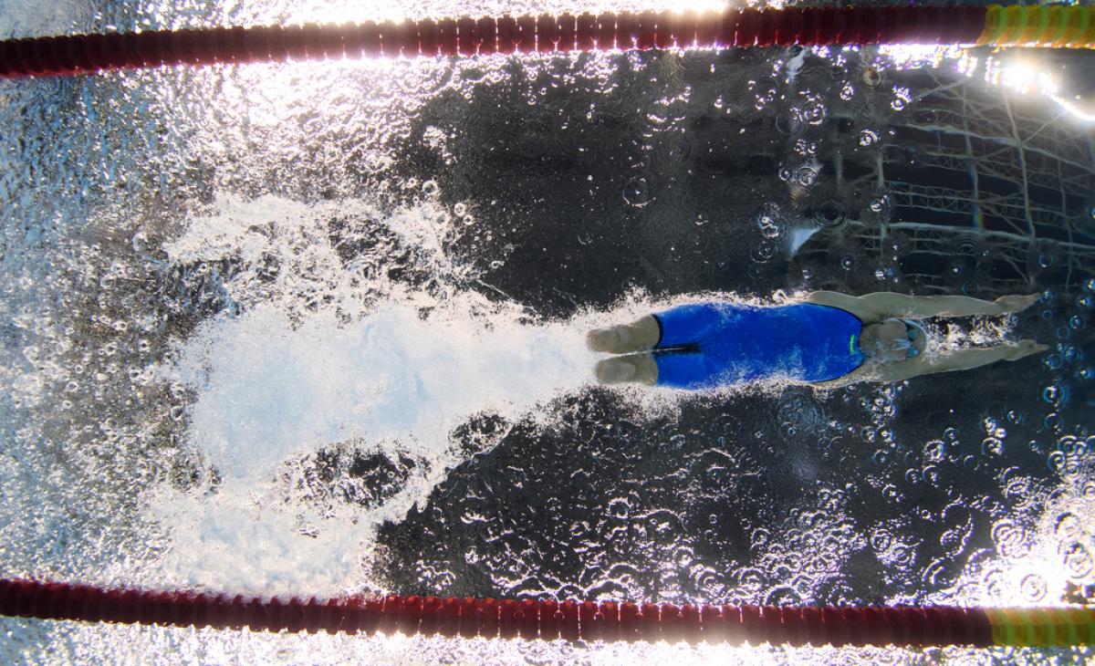 An underwater image of a female swimmer without legs