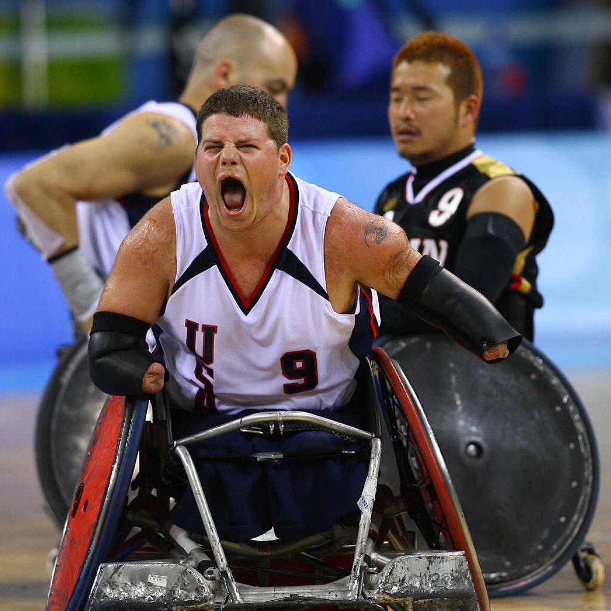 Male wheelchair rugby player celebrating 