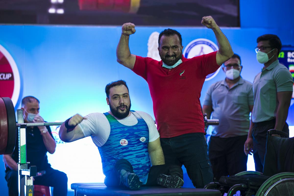 Roohallah Rostami celebrates with his coach