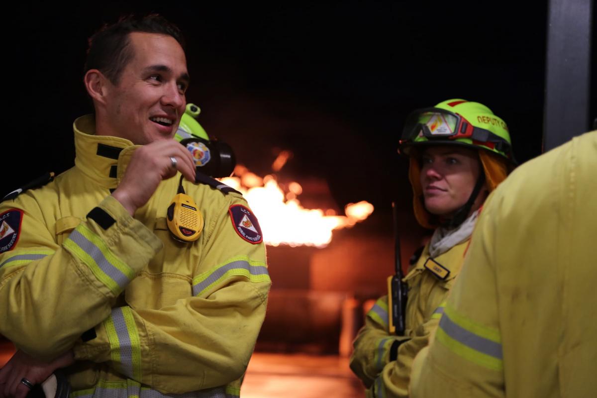 Man and woman in firefighters gear