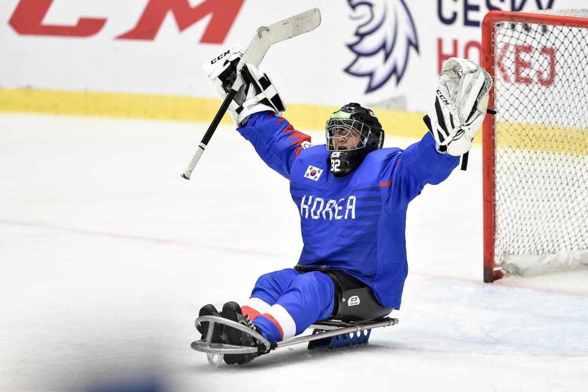A Korean Para ice hockey goaltender celebrating on ice