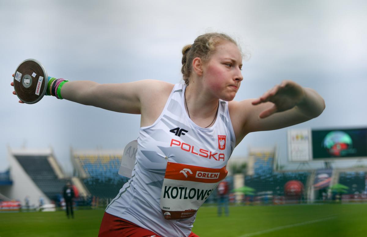 A woman competing in the discus throw in an athletics event